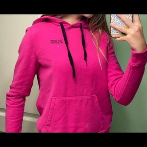 PINK sweat shirt with black logos and black string